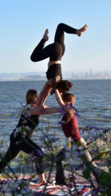 holly saitta yoga garden sf partner acro yoga poppy yoga san francisco joy happy play